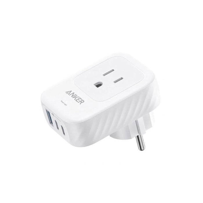 Top angled view of white Anker travel adapter showing front socket layout and bottom charging ports