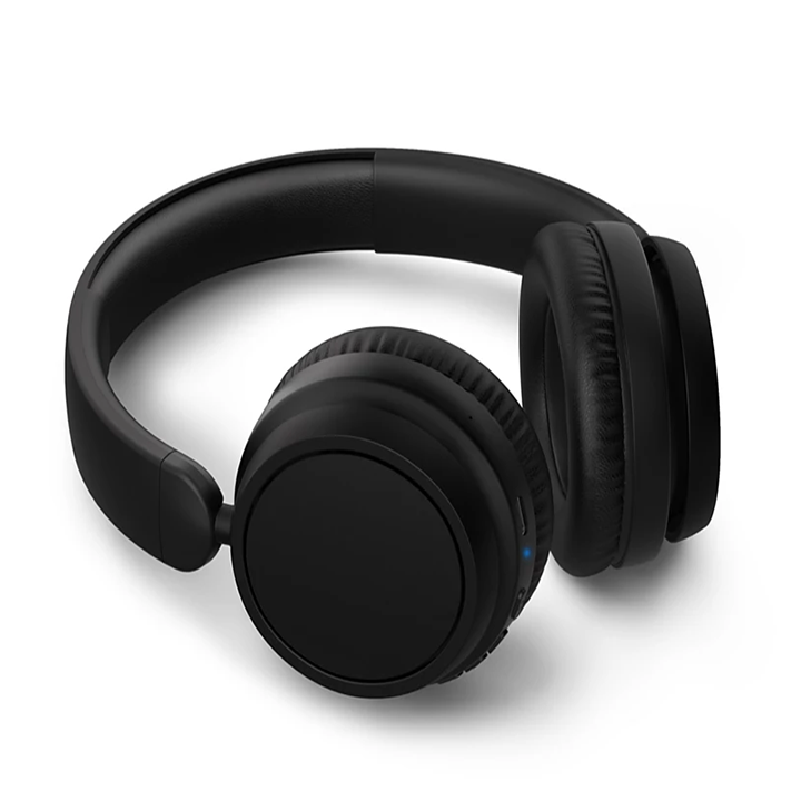 Angle shot of Philips TAH5209BK black over-ear headphones showing cushioned ear pads