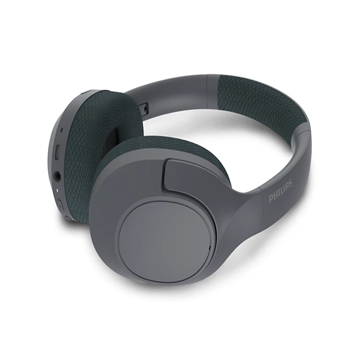 Philips TAH7508BK wireless headphones resting showing side controls, AUX, and USB-C ports